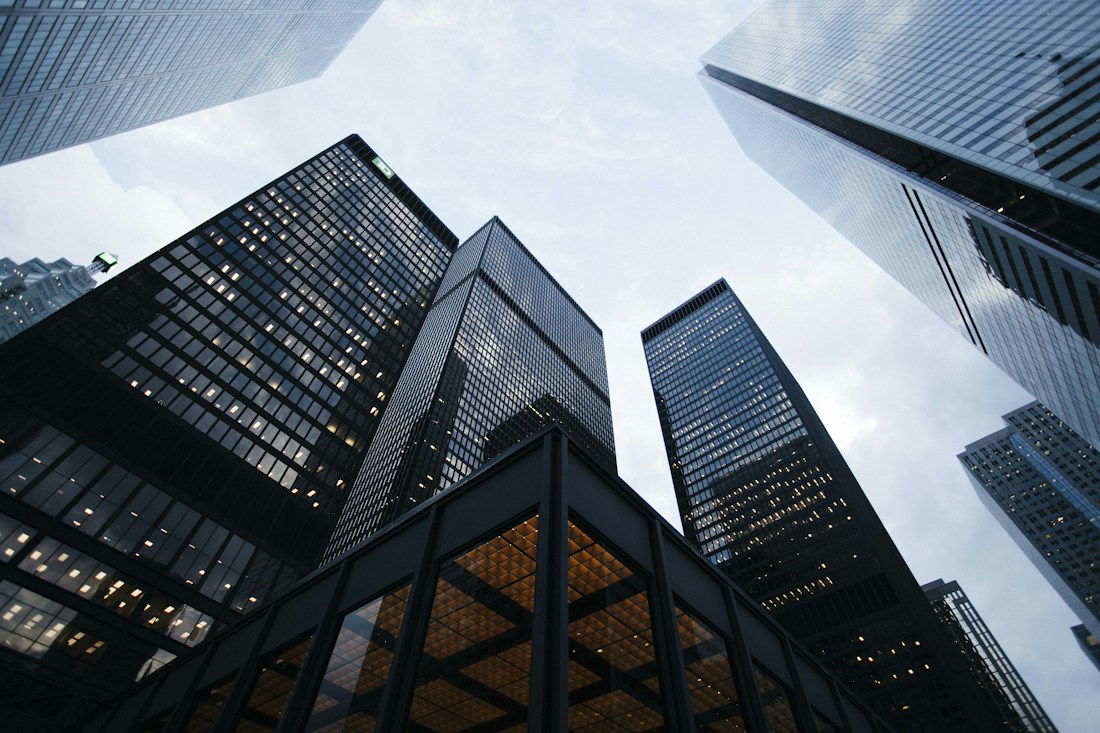 Modern glass office building viewed from below